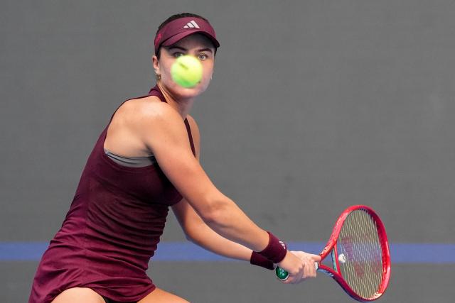 (261007) -- BEIJING, Oct. 7, 2026 (Xinhua) -- Iva Jovic hits a return during the women's singles fourth round match between Iga Swiatek of Poland and Iva Jovic of the United States at 2026 China Open tennis tournament in Beijing, China, Oct. 7, 2026. (Xinhua/Ju Huanzong)