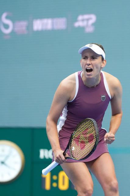 (261007) -- BEIJING, Oct. 7, 2026 (Xinhua) -- Elise Mertens celebrates during the women's singles fourth round match between Coco Gauff of the United States and Elise Mertens of Belgium at 2026 China Open tennis tournament in Beijing, China, Oct. 7, 2026. (Xinhua/Ju Huanzong)