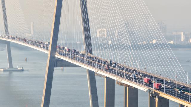 (261007) -- BEIJING, Oct. 7, 2026 (Xinhua) -- An aerial drone photo taken on Oct. 7, 2026 shows vehicles running on the Sutong Bridge in east China's Jiangsu Province. As the National Day holiday is drawing to a close, return travel flows increase across the country. (Photo by Qian Xianhua/Xinhua)