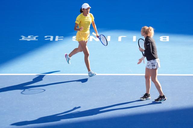 (261007) -- BEIJING, Oct. 7, 2026 (Xinhua) -- Katerina Siniakova/Zhang Shuai (L) compete during the women's doubles round of 16 match between Katerina Siniakova(the Cezch Republic)/Zhang Shuai(China) and Nikola Bartunkova(the Cezch Republic)/Maja Chwalinska(Poland) at 2026 China Open tennis tournament in Beijing, China, Oct. 7, 2026. (Xinhua/Ju Huanzong)