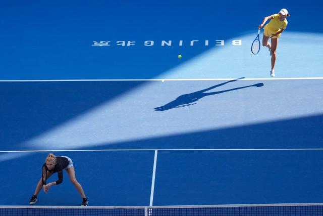 (261007) -- BEIJING, Oct. 7, 2026 (Xinhua) -- Katerina Siniakova/Zhang Shuai (R) compete during the women's doubles round of 16 match between Katerina Siniakova(the Cezch Republic)/Zhang Shuai(China) and Nikola Bartunkova(the Cezch Republic)/Maja Chwalinska(Poland) at 2026 China Open tennis tournament in Beijing, China, Oct. 7, 2026. (Xinhua/Ju Huanzong)