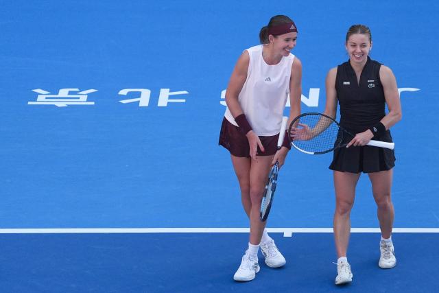 (261007) -- BEIJING, Oct. 7, 2026 (Xinhua) -- Nikola Bartunkova(L)/Maja Chwalinska react during the women's doubles round of 16 match between Katerina Siniakova(the Cezch Republic)/Zhang Shuai(China) and Nikola Bartunkova(the Cezch Republic)/Maja Chwalinska(Poland) at 2026 China Open tennis tournament in Beijing, China, Oct. 7, 2026. (Xinhua/Ju Huanzong)