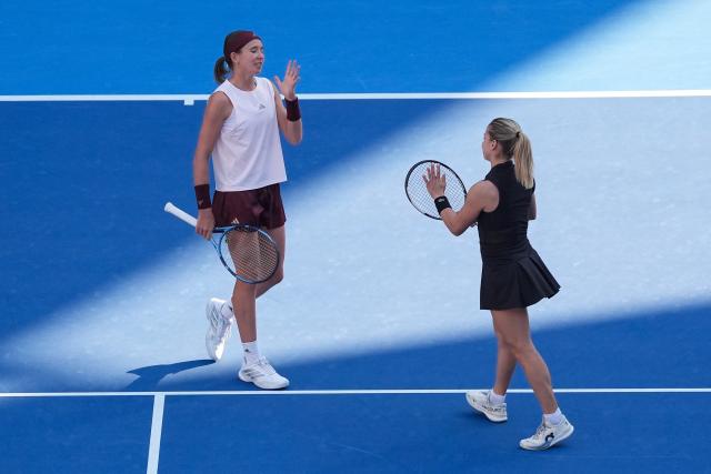 (261007) -- BEIJING, Oct. 7, 2026 (Xinhua) -- Nikola Bartunkova(L)/Maja Chwalinska react during the women's doubles round of 16 match between Katerina Siniakova(the Cezch Republic)/Zhang Shuai(China) and Nikola Bartunkova(the Cezch Republic)/Maja Chwalinska(Poland) at 2026 China Open tennis tournament in Beijing, China, Oct. 7, 2026. (Xinhua/Ju Huanzong)