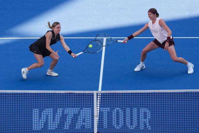 (261007) -- BEIJING, Oct. 7, 2026 (Xinhua) -- Nikola Bartunkova(R)/Maja Chwalinska compete during the women's doubles round of 16 match between Katerina Siniakova(the Cezch Republic)/Zhang Shuai(China) and Nikola Bartunkova(the Cezch Republic)/Maja Chwalinska(Poland) at 2026 China Open tennis tournament in Beijing, China, Oct. 7, 2026. (Xinhua/Ju Huanzong)