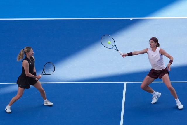 (261007) -- BEIJING, Oct. 7, 2026 (Xinhua) -- Nikola Bartunkova(R)/Maja Chwalinska compete during the women's doubles round of 16 match between Katerina Siniakova(the Cezch Republic)/Zhang Shuai(China) and Nikola Bartunkova(the Cezch Republic)/Maja Chwalinska(Poland) at 2026 China Open tennis tournament in Beijing, China, Oct. 7, 2026. (Xinhua/Ju Huanzong)