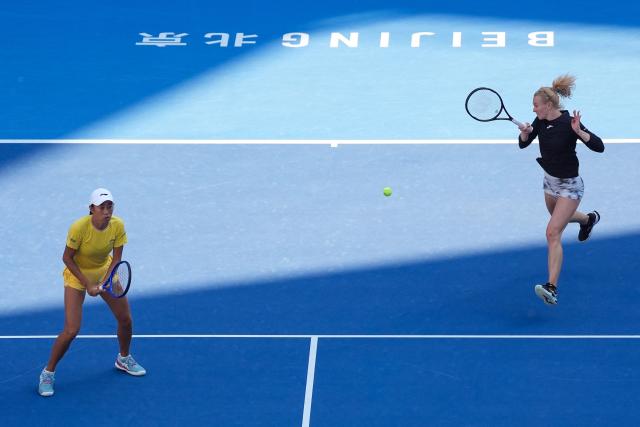 (261007) -- BEIJING, Oct. 7, 2026 (Xinhua) -- Katerina Siniakova (R)/Zhang Shuai compete during the women's doubles round of 16 match between Katerina Siniakova(the Cezch Republic)/Zhang Shuai(China) and Nikola Bartunkova(the Cezch Republic)/Maja Chwalinska(Poland) at 2026 China Open tennis tournament in Beijing, China, Oct. 7, 2026. (Xinhua/Ju Huanzong)
