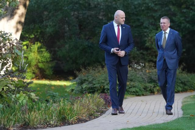 (261007) -- RIGA, Oct. 7, 2026 (Xinhua) -- Latvian President Edgars Rinkevics (R) and incumbent Prime Minister Andris Kulbergs hold a meeting at the Riga Castle in Riga, Latvia, Oct. 7, 2026. Latvian President Edgars Rinkevics said on Tuesday that incumbent Prime Minister Andris Kulbergs would lead talks on forming the Baltic country's next government following his party's sweeping victory in last Saturday's parliamentary election. (Photo by Edijs Palens/Xinhua)