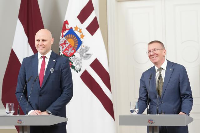 (261007) -- RIGA, Oct. 7, 2026 (Xinhua) -- Latvian President Edgars Rinkevics (R) and incumbent Prime Minister Andris Kulbergs hold a joint press conference at the Riga Castle in Riga, Latvia, Oct. 7, 2026. Latvian President Edgars Rinkevics said on Tuesday that incumbent Prime Minister Andris Kulbergs would lead talks on forming the Baltic country's next government following his party's sweeping victory in last Saturday's parliamentary election. (Photo by Edijs Palens/Xinhua)