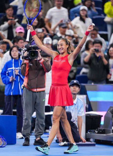 (261007) -- BEIJING, Oct. 7, 2026 (Xinhua) -- Zheng Qinwen of China celebrates after winning the women's singles fourth round match between Zheng Qinwen of China and Alina Charaeva of Armenia at 2026 China Open tennis tournament in Beijing, China, Oct. 7, 2026. (Xinhua/Sun Fei)