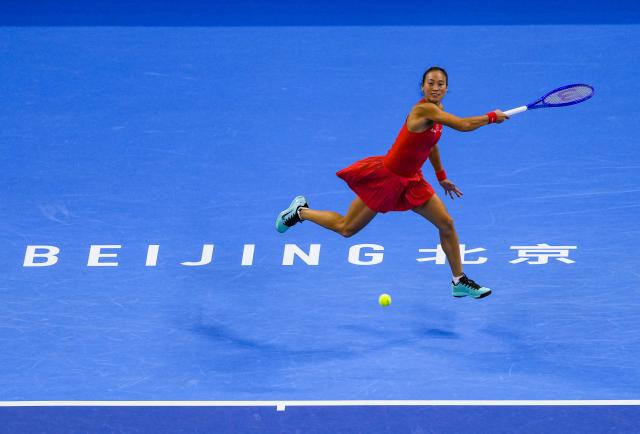 (261007) -- BEIJING, Oct. 7, 2026 (Xinhua) -- Zheng Qinwen of China hits a return during the women's singles fourth round match between Zheng Qinwen of China and Alina Charaeva of Armenia at 2026 China Open tennis tournament in Beijing, China, Oct. 7, 2026. (Xinhua/Sun Fei)