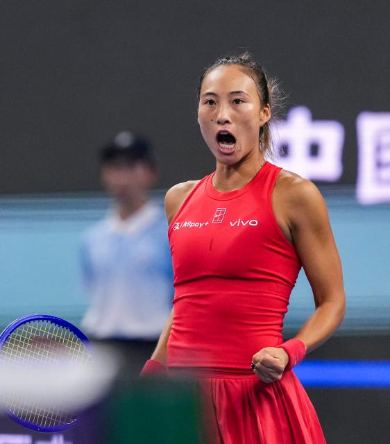(261007) -- BEIJING, Oct. 7, 2026 (Xinhua) -- Zheng Qinwen of China celebrates after winning the women's singles fourth round match between Zheng Qinwen of China and Alina Charaeva of Armenia at 2026 China Open tennis tournament in Beijing, China, Oct. 7, 2026. (Xinhua/Sun Fei)