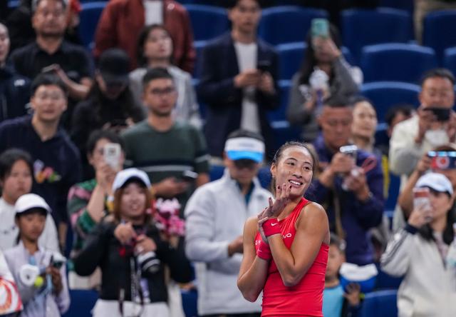 (261007) -- BEIJING, Oct. 7, 2026 (Xinhua) -- Zheng Qinwen of China celebrates after winning the women's singles fourth round match between Zheng Qinwen of China and Alina Charaeva of Armenia at 2026 China Open tennis tournament in Beijing, China, Oct. 7, 2026. (Xinhua/Sun Fei)
