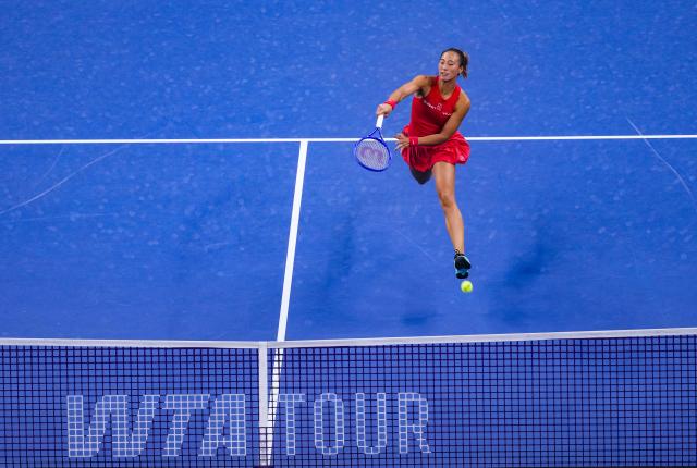 (261007) -- BEIJING, Oct. 7, 2026 (Xinhua) -- Zheng Qinwen of China hits a return during the women's singles fourth round match between Zheng Qinwen of China and Alina Charaeva of Armenia at 2026 China Open tennis tournament in Beijing, China, Oct. 7, 2026. (Xinhua/Sun Fei)