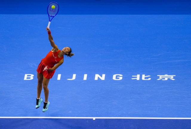 (261007) -- BEIJING, Oct. 7, 2026 (Xinhua) -- Zheng Qinwen of China serves during the women's singles fourth round match between Zheng Qinwen of China and Alina Charaeva of Armenia at 2026 China Open tennis tournament in Beijing, China, Oct. 7, 2026. (Xinhua/Sun Fei)