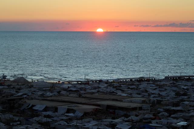 (261007) -- GAZA CITY, Oct. 7, 2026 (Xinhua) -- This photo taken on Oct. 6, 2026 shows a view of a makeshift tent camp in Gaza City. The latest round of Gaza conflict marks its third anniversary on Wednesday. (Photo by Rizek Abdeljawad/Xinhua)