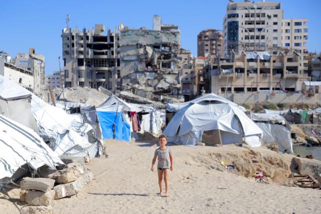 (261007) -- GAZA CITY, Oct. 7, 2026 (Xinhua) -- A child is seen at a makeshift tent camp in Gaza City, Oct. 7, 2026. The latest round of Gaza conflict marks its third anniversary on Wednesday. (Photo by Rizek Abdeljawad/Xinhua)