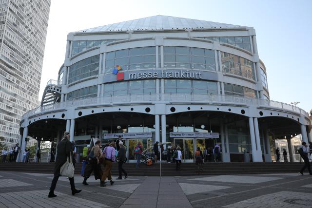 (261007) -- FRANKFURT, Oct. 7, 2026 (Xinhua) -- People walk into the venue of the Frankfurt Book Fair in Frankfurt, Germany, Oct. 7, 2026. The world's largest book fair opened Wednesday in Frankfurt, Germany, bringing together more than 4,000 publishing institutions from over 100 countries and regions.
  The Chinese joint exhibition booth covers 336 square meters and features more than 3,000 titles and over 4,600 copies of selected books. It combines book displays, rights negotiations, cultural exchanges and interactive experiences. (Xinhua/Du Zheyu)