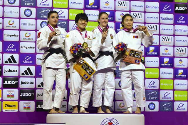 (261008) -- BAKU, Oct. 8, 2026 (Xinhua) -- (L to R) Silver medalist Kerem Primo of Israel, gold medalist Kaju Haruka of Japan, bronze medalists Renata Zachova of the Czech Republic and Enkhriilen Lkhagvatogoo of Mongolia pose for a group photo on the podium for the women's -63kg at the 2026 World Senior Judo Championships in Baku on Oct. 7, 2026. (Xinhua/Chen Junfeng)
