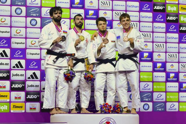 (261008) -- BAKU, Oct. 8, 2026 (Xinhua) -- (L to R) Silver medalist Zelim Tckaev of Azerbaijan, gold medalist Tato Grigalashvili of Georgia, bronze medalists Omar Rajabli of Azerbaijan and Mihajlo Simin of Serbia pose for a group photo on the podium for the men's -81kg at the 2026 World Senior Judo Championships in Baku on Oct. 7, 2026. (Xinhua/Chen Junfeng)