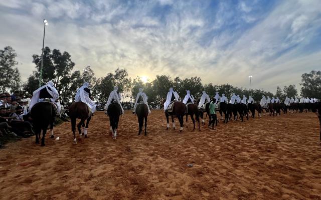 (261008) -- TRIPOLI, Oct. 8, 2026 (Xinhua) -- Riders take part in a traditional equestrian festival in Souq al-Khamis Amsihel, Libya, Oct. 7, 2026. (Photo by Hazem Turkia/Xinhua)