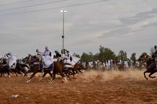 (261008) -- TRIPOLI, Oct. 8, 2026 (Xinhua) -- Riders take part in a traditional equestrian festival in Souq al-Khamis Amsihel, Libya, Oct. 7, 2026. (Photo by Hazem Turkia/Xinhua)