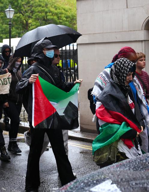 (261008) -- LONDON, Oct. 8, 2026 (Xinhua) -- People participate in a pro-Palestinian demonstration in London, Britain, Oct. 7, 2026. Eleven people were arrested as multiple pro-Palestinian demonstrations were held in London on Wednesday, the Metropolitan Police was quoted by the BBC on Wednesday as saying. (Xinhua/Zhang Feng)