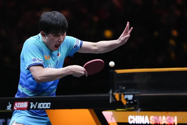 (261008) -- BEIJING, Oct. 8, 2026 (Xinhua) -- Harimoto Tomokazu of Japan hits a return during the men's singles round of 16 match between Zhou Qihao of China and Harimoto Tomokazu of Japan at 2026 World Table Tennis (WTT) China Smash in Beijing, China, Oct. 8, 2026. (Xinhua/Ju Huanzong)