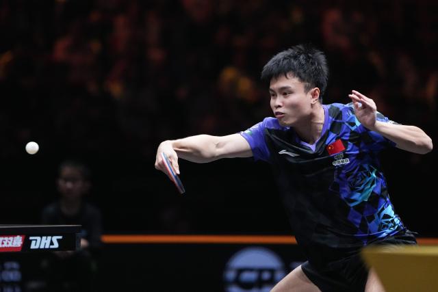 (261008) -- BEIJING, Oct. 8, 2026 (Xinhua) -- Zhou Qihao of China hits a return during the men's singles round of 16 match between Zhou Qihao of China and Harimoto Tomokazu of Japan at 2026 World Table Tennis (WTT) China Smash in Beijing, China, Oct. 8, 2026. (Xinhua/Ju Huanzong)