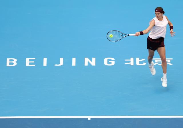 (261008) -- BEIJING, Oct. 8, 2026 (Xinhua) -- Nikola Bartunkova of the Czech Republic hits a return during the women's singles quarterfinal match between Karolina Muchova of the Czech Republic and Nikola Bartunkova of the Czech Republic at 2026 China Open tennis tournament in Beijing, China, Oct. 8, 2026. (Xinhua/Zhang Chenlin)