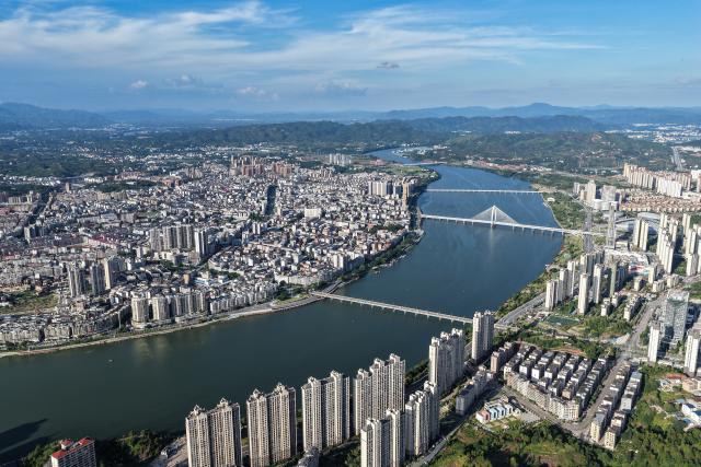 (261008) -- NANCHANG, Oct. 8, 2026 (Xinhua) -- An aerial drone photo taken on Aug. 18, 2026 shows a view of Yudu County, east China's Jiangxi Province. (Xinhua/Zhou Mi)