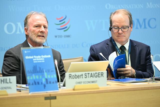 (261008) -- GENEVA, Oct. 8, 2026 (Xinhua) -- World Trade Organization (WTO) Chief Economist Robert Staiger (L) speaks during a press conference at the WTO headquarters in Geneva, Switzerland, Oct. 8, 2026. WTO said on Thursday that global merchandise trade is expected to grow by 3.9 percent in 2026, up from its March forecast of 1.9 percent, driven by supply chain adaptation and strong investment in artificial intelligence (AI). (Xinhua/Lian Yi)