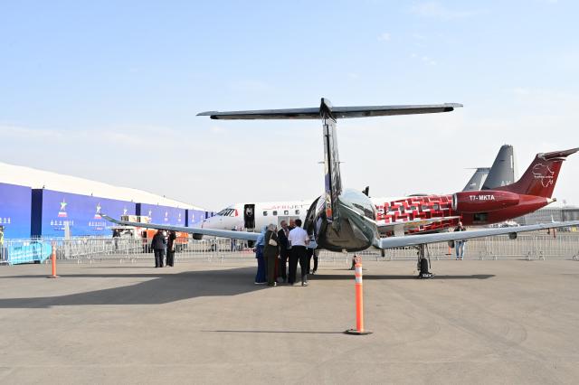 (261008) -- MARRAKECH, Oct. 8, 2026 (Xinhua) -- Visitors learn about exhibits at the Marrakech Air Show 2026 in Marrakech, Morocco, Oct. 7, 2026. The eighth edition of the Marrakech Air Show is being held at the Marrakech Royal Moroccan Air Force Base from Wednesday to Saturday. More than 200 aerospace and defense companies from 19 countries are participating in the event. (Photo by Aissa/Xinhua)