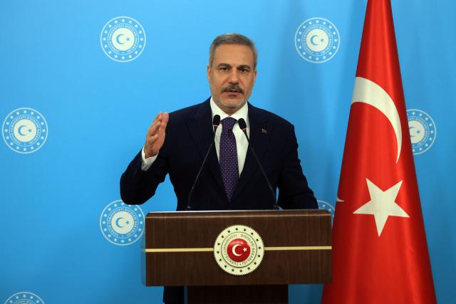 (261008) -- ANKARA, Oct. 8, 2026 (Xinhua) -- Turkish Foreign Minister Hakan Fidan speaks at a press conference in Ankara, Türkiye, on Oct. 8, 2026. Türkiye will not deploy troops to another country's territory to launch an attack, Turkish Foreign Minister Hakan Fidan said on Thursday, stressing the defensive nature of the Mecca Joint Defense Agreement. (Mustafa Kaya/Handout via Xinhua)