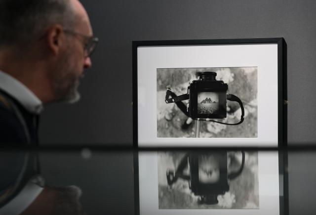 (261008) -- PARIS, Oct. 8, 2026 (Xinhua) -- A man visits an exhibition on the history of cameras and photography at the Salon Photo & Video in Paris, France, Oct. 8, 2026. The Salon Photo & Video opened in Paris on Thursday, featuring equipment displays, photography exhibitions, talks and hands-on activities. (Xinhua/Wu Huiwo)