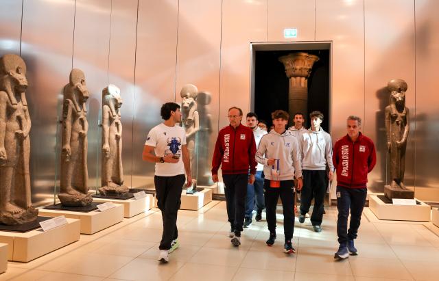 (261009) -- TURIN, Oct. 9, 2026 (Xinhua) -- The flame is carried in the Egyptian Museum of Turin after the flame collection ceremony for the Changchun 2027 Winter Universiade in Turin, Italy, Oct. 8, 2026. (Xinhua/Wang Kaiyan)