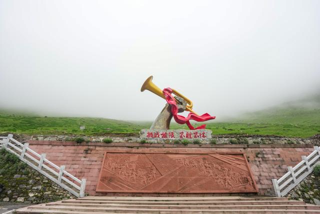 (261009) -- CHENGDU, Oct. 9, 2026 (Xinhua) -- An aerial drone photo taken on June 2, 2026 shows a "horn of victory" themed installation at Jiajin Mountain in Baoxing County of Ya'an City, southwest China's Sichuan Province. The year 2026 marks the 90th anniversary of the victory of the Long March. Sichuan became closely tied to the Red Army's activities from 1935 to 1936. During the Long March, the Red Army crossed the Jinsha River, formed the Yihai Alliance, fought their way across the Dadu River, seized the Luding Bridge, scaled snow-capped mountains and traversed grasslands, and continued their march northward to victory. (Xinhua/Wang Xi)