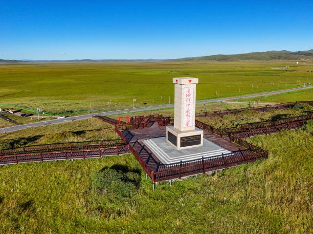 (261009) -- CHENGDU, Oct. 9, 2026 (Xinhua) -- An aerial drone photo taken on Aug. 13, 2026 shows a monument commemorating the Red Army's traversing of the grasslands at a wetland in Hongyuan County of Aba Tibetan and Qiang Autonomous Prefecture, southwest China's Sichuan Province. The year 2026 marks the 90th anniversary of the victory of the Long March. Sichuan became closely tied to the Red Army's activities from 1935 to 1936. During the Long March, the Red Army crossed the Jinsha River, formed the Yihai Alliance, fought their way across the Dadu River, seized the Luding Bridge, scaled snow-capped mountains and traversed grasslands, and continued their march northward to victory. (Xinhua/Wang Xi)
