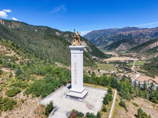 (261009) -- CHENGDU, Oct. 9, 2026 (Xinhua) -- An aerial drone photo taken on Sept. 3, 2026 shows a monument commemorating the northward march of the Red Army in Qiuji Town, Zogie County of southwest China's Sichuan Province. The year 2026 marks the 90th anniversary of the victory of the Long March. Sichuan became closely tied to the Red Army's activities from 1935 to 1936. During the Long March, the Red Army crossed the Jinsha River, formed the Yihai Alliance, fought their way across the Dadu River, seized the Luding Bridge, scaled snow-capped mountains and traversed grasslands, and continued their march northward to victory. (Xinhua/Wang Xi)