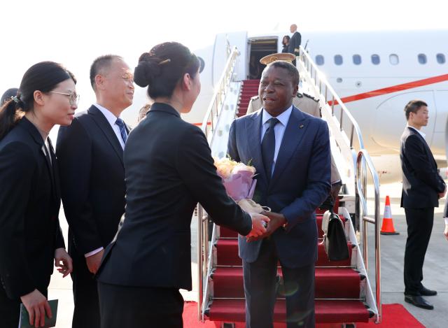 (261009) -- XI'AN, Oct. 9, 2026 (Xinhua) -- President of the Council of Ministers of Togo Faure Essozimna Gnassingbé arrives in Xi'an, northwest China's Shaanxi Province, Oct. 9, 2026. At the invitation of Chinese Premier Li Qiang, Faure arrived in Xi'an on Friday for an official visit to China from Oct. 9 to 16. (Xinhua/Li Yibo)