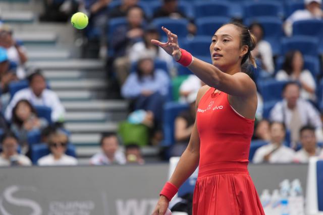(261009) -- BEIJING, Oct. 9, 2026 (Xinhua) -- Zheng Qinwen of China catches the ball during the women's singles quarterfinal match between Zheng Qinwen of China and Elina Svitolina of Ukraine at 2026 China Open tennis tournament in Beijing, China, Oct. 9, 2026. (Xinhua/Xie Han)