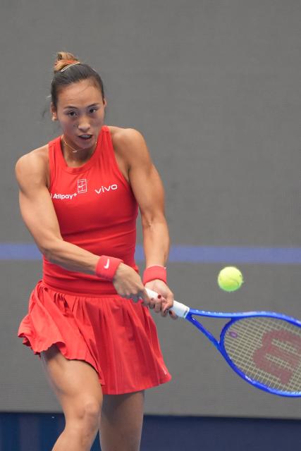 (261009) -- BEIJING, Oct. 9, 2026 (Xinhua) -- Zheng Qinwen of China hits a return during the women's singles quarterfinal match between Zheng Qinwen of China and Elina Svitolina of Ukraine at 2026 China Open tennis tournament in Beijing, China, Oct. 9, 2026. (Xinhua/Xie Han)