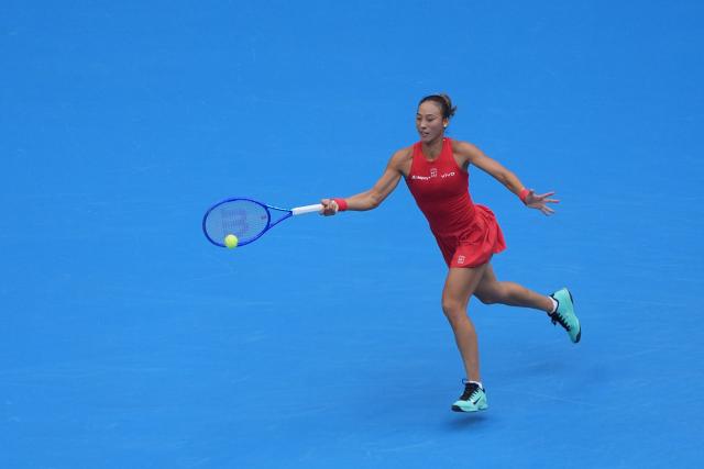 (261009) -- BEIJING, Oct. 9, 2026 (Xinhua) -- Zheng Qinwen of China hits a return during the women's singles quarterfinal match between Zheng Qinwen of China and Elina Svitolina of Ukraine at 2026 China Open tennis tournament in Beijing, China, Oct. 9, 2026. (Xinhua/Xie Han)