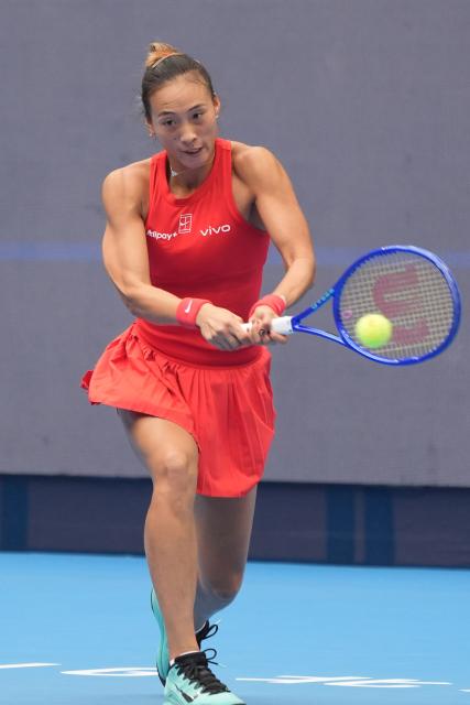 (261009) -- BEIJING, Oct. 9, 2026 (Xinhua) -- Zheng Qinwen of China hits a return during the women's singles quarterfinal match between Zheng Qinwen of China and Elina Svitolina of Ukraine at 2026 China Open tennis tournament in Beijing, China, Oct. 9, 2026. (Xinhua/Xie Han)