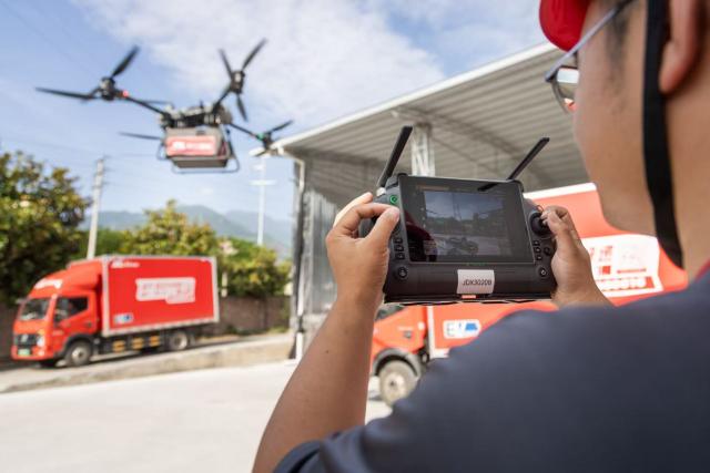 (261009) -- CHENGDU, Oct. 9, 2026 (Xinhua) -- This photo taken in April 2026 shows a drone of JD Logistics taking part in the harvest of sweet cherry in Hanyuan County, southwest China's Sichuan Province. (Xinhua)