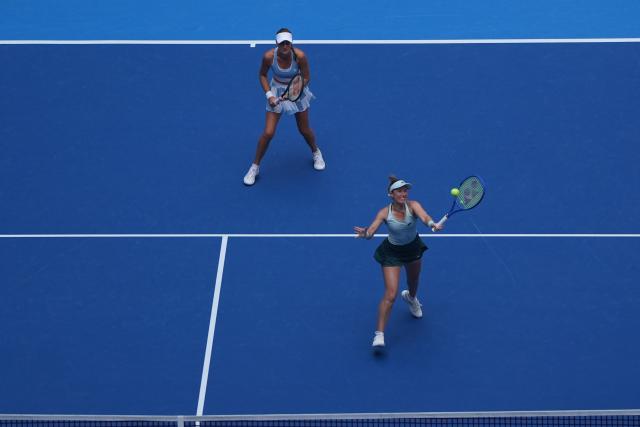(261009) -- BEIJING, Oct. 9, 2026 (Xinhua) -- Storm Hunter (R)/Kristina Mladenovic compete during the women's doubles quarterfinal match between Katerina Siniakova (the Cezch Republic)/Zhang Shuai (China) and Storm Hunter (Australia)/Kristina Mladenovic (France) at 2026 China Open tennis tournament in Beijing, China, Oct. 9, 2026. (Xinhua/Xie Han)