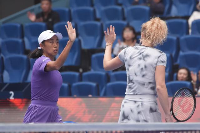 (261009) -- BEIJING, Oct. 9, 2026 (Xinhua) -- Katerina Siniakova (R)/Zhang Shuai celebrate scoring during the women's doubles quarterfinal match between Katerina Siniakova (the Cezch Republic)/Zhang Shuai (China) and Storm Hunter (Australia)/Kristina Mladenovic (France) at 2026 China Open tennis tournament in Beijing, China, Oct. 9, 2026. (Xinhua/Xie Han)