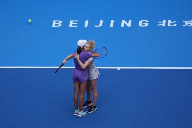 (261009) -- BEIJING, Oct. 9, 2026 (Xinhua) -- Katerina Siniakova (R)/Zhang Shuai celebrate after winning the women's doubles quarterfinal match between Katerina Siniakova (the Cezch Republic)/Zhang Shuai (China) and Storm Hunter (Australia)/Kristina Mladenovic (France) at 2026 China Open tennis tournament in Beijing, China, Oct. 9, 2026. (Xinhua/Xie Han)
