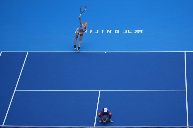 (261009) -- BEIJING, Oct. 9, 2026 (Xinhua) -- Katerina Siniakova (top)/Zhang Shuai compete during the women's doubles quarterfinal match between Katerina Siniakova (the Cezch Republic)/Zhang Shuai (China) and Storm Hunter (Australia)/Kristina Mladenovic (France) at 2026 China Open tennis tournament in Beijing, China, Oct. 9, 2026. (Xinhua/Xie Han)