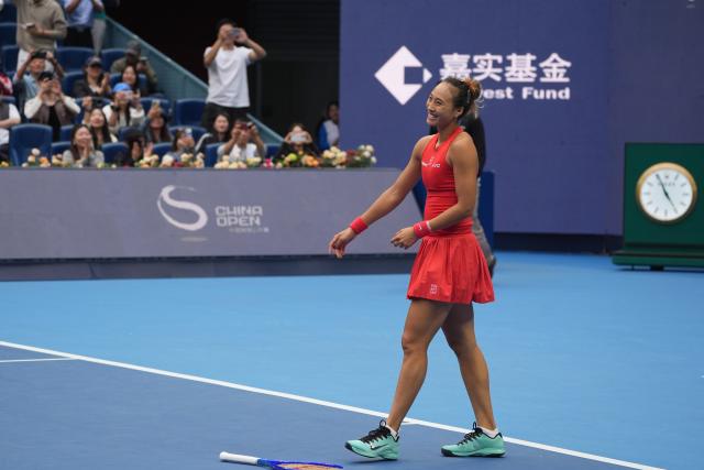 (261009) -- BEIJING, Oct. 9, 2026 (Xinhua) -- Zheng Qinwen celebrates after winning the women's singles quarterfinal match between Zheng Qinwen of China and Elina Svitolina of Ukraine at 2026 China Open tennis tournament in Beijing, China, Oct. 9, 2026. (Xinhua/Xie Han)