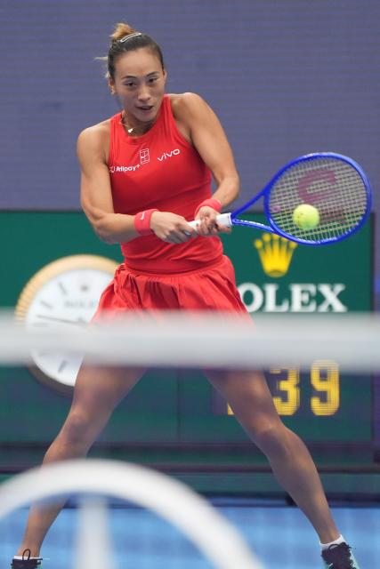 (261009) -- BEIJING, Oct. 9, 2026 (Xinhua) -- Zheng Qinwen hits a return during the women's singles quarterfinal match between Zheng Qinwen of China and Elina Svitolina of Ukraine at 2026 China Open tennis tournament in Beijing, China, Oct. 9, 2026. (Xinhua/Xie Han)
